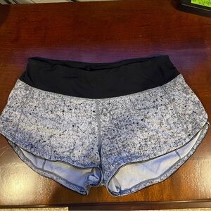 Lululemon mid rise Speed Up shorts. Size 4 color black and gray.
